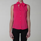 Camicia crepe sbracciata bottoni fiocco rosa fucsia